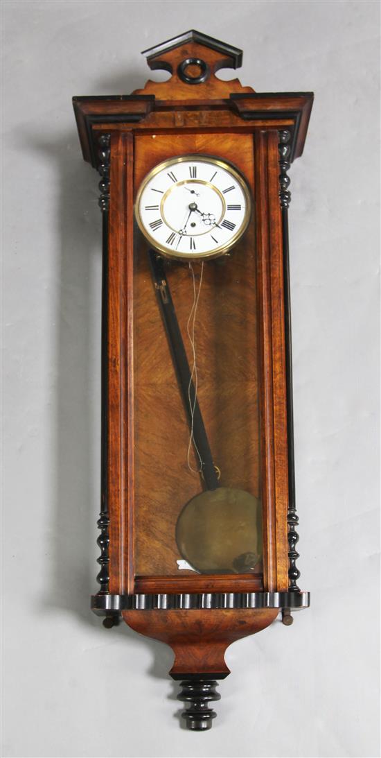 A 19th century walnut and ebonised Vienna wall timepiece, H.44in.